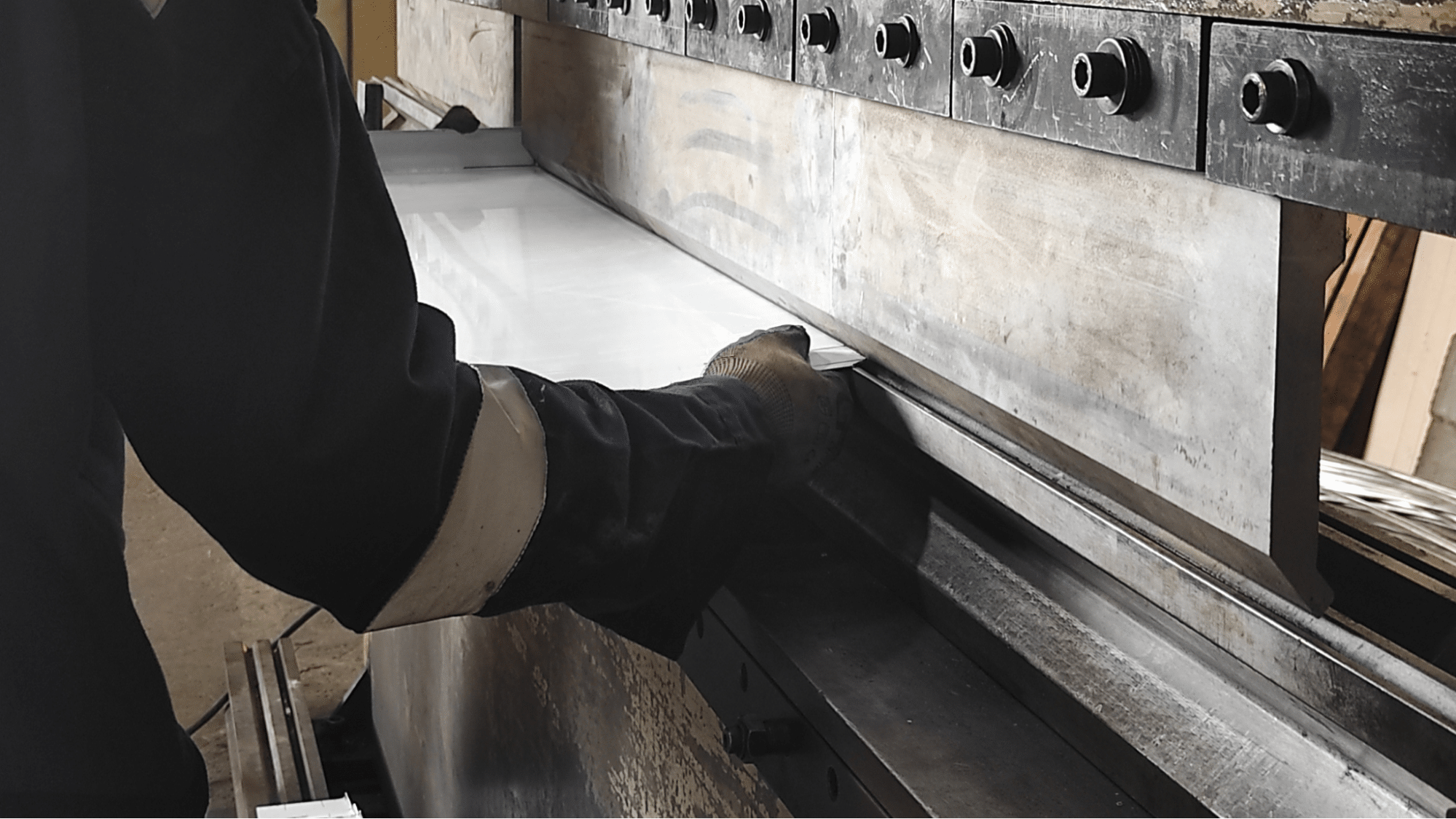 Person holding a piece of metal